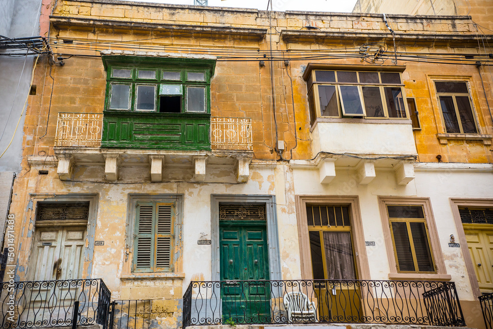 Traditional Maltese architecture. Old historical part of La Valetta with narrow streets and wooden balconies, La Valetta, Malta