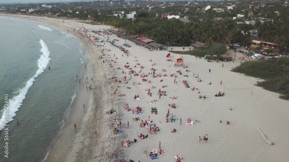 crowded beach on the pacific ocean, this beach ins punta Zicatela known world wide for its waves and beeing known as the mexican pipeline crowded beach on the pacific ocean, this beach ins punta Zicatela known world wide for its waves and beeing known as the mexican pipeline