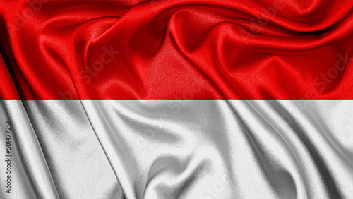 Close up realistic texture fabric textile silk satin flag of Indonesia waving fluttering background. National symbol of the country. 17th of August, Happy Day concept 