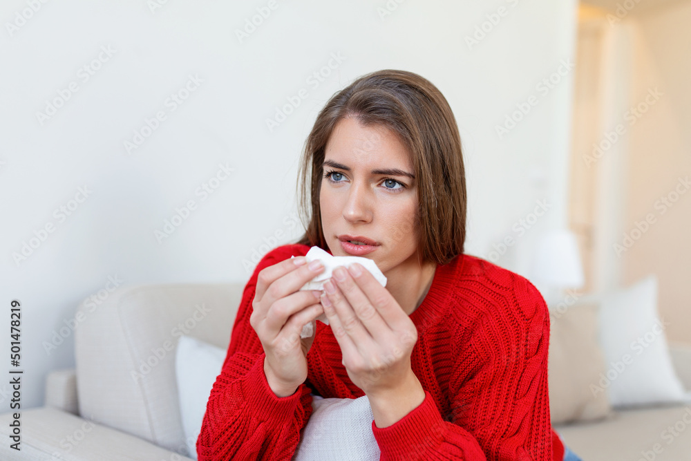 Sick desperate woman has flu. Rhinitis, cold, sickness, allergy concept. Pretty sick woman has runnning nose, rubs nose with handkerchief. Sneezing female. Brunette sneezing in a tissue Sick desperate woman has flu. Rhinitis, cold, sickness, allergy concept. Pretty sick woman has runnning nose, rubs nose with handkerchief. Sneezing female. Brunette sneezing in a tissue