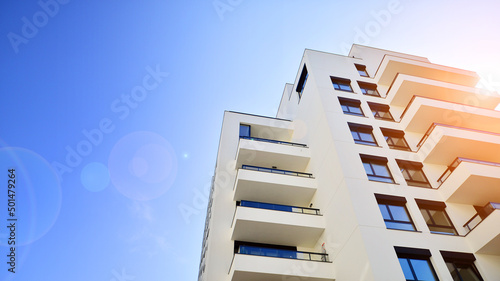 Modern residential apartment house architecture in europe. Innovative and resident-friendly architectural solutions. Blue sky on the background. With sunlight.