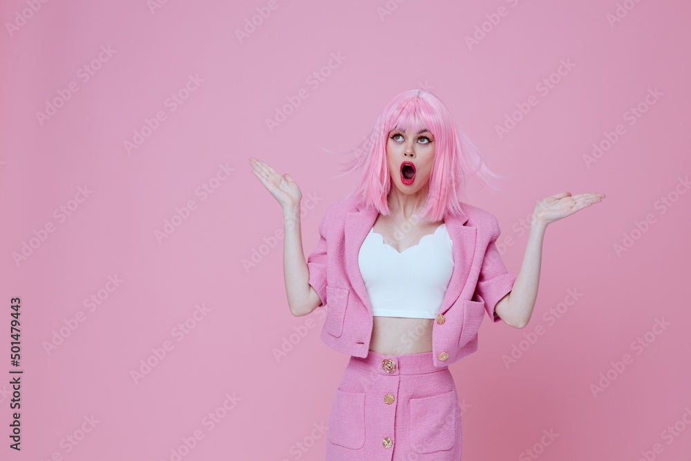 Beautiful fashionable girl gesturing with hands pink jacket lifestyle glamor color background unaltered