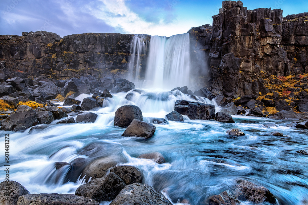 Oxarafoss, or the waterfall in the Ax River, in the Thingvellir national park, Iceland in autumn Oxarafoss, or the waterfall in the Ax River, in the Thingvellir national park, Iceland in autumn
