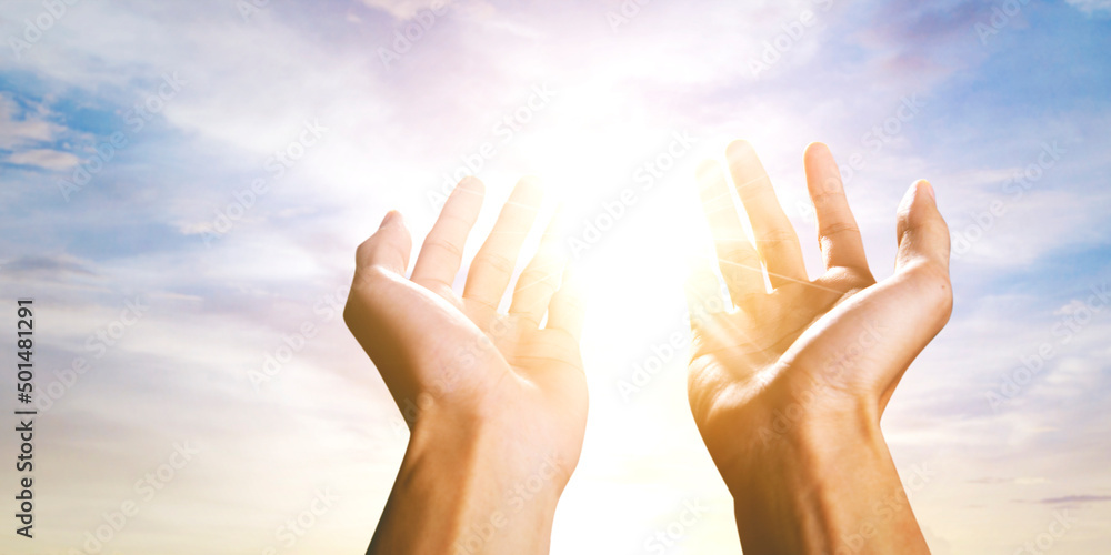 Muslim man hands lift toward the sky while praying Muslim man hands lift toward the sky while praying
