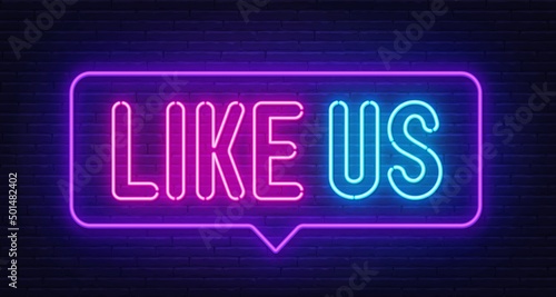 Like Us neon sign in the speech bubble on brick wall background.