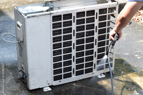  Aircondition Maintenance.Air condition cleaning concept. Technician cleanning service and maintenance.