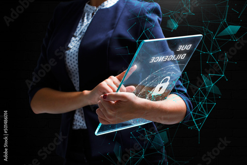 Business, Technology, Internet and network concept. Young businessman working on a virtual screen of the future and sees the inscription: Due diligence