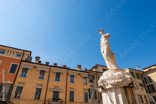 Marble statue and fountain of Minerva, 1818, by the sculptor from Verona Gaetano Cignaroli (1747-1826). Square called Piazza Paolo VI or Piazza del Duomo (Cathedral square). Lombardy, Italy, Europe. photo