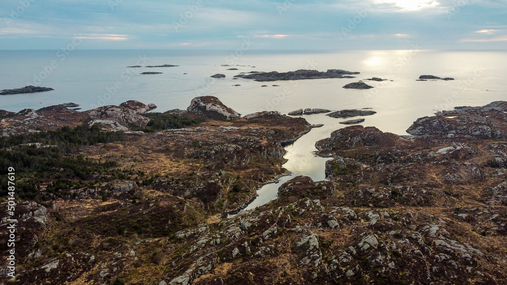 Aerial view of the sea wave and rocks of the coastline of Norway, Telavåg. Panoramic view of the rocks by the sea. The sea wave rolls along the shore. View of the sea coast from the air. Ocean space Aerial view of the sea wave and rocks of the coastline of Norway, Telavåg. Panoramic view of the rocks by the sea. The sea wave rolls along the shore. View of the sea coast from the air. Ocean space