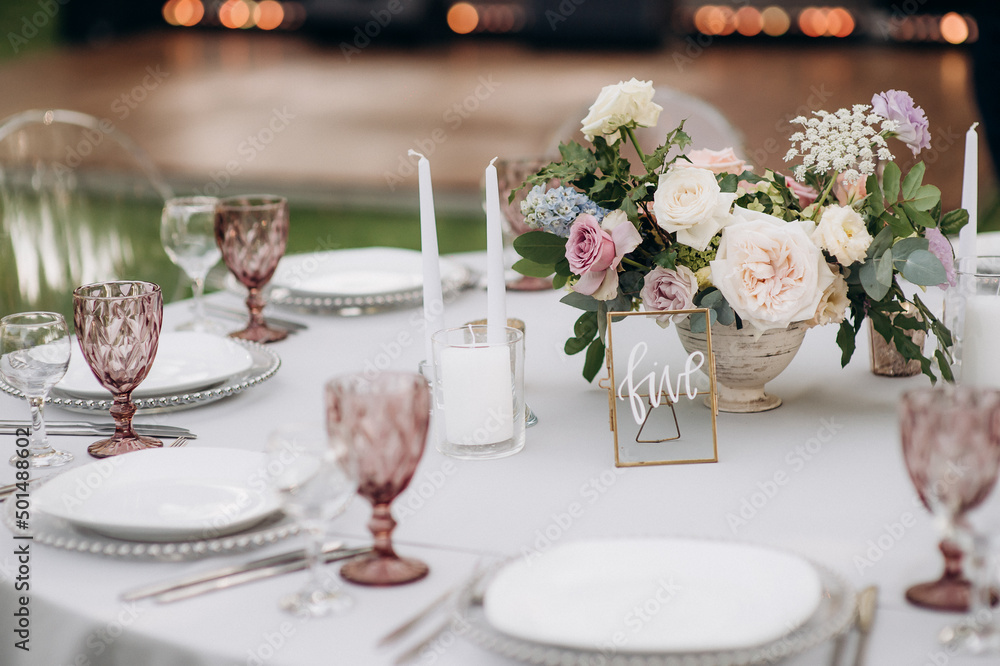 central flower arrangement on a served banquet table central flower arrangement on a served banquet table
