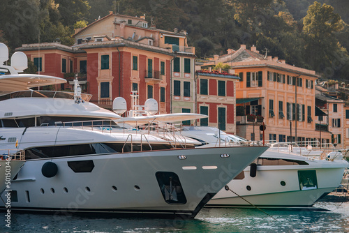 Liguria, Italy, Europe. Luxury yachts and boats in The beautiful Portofino with colorful houses and villas,  in little bay harbor. © Doralin