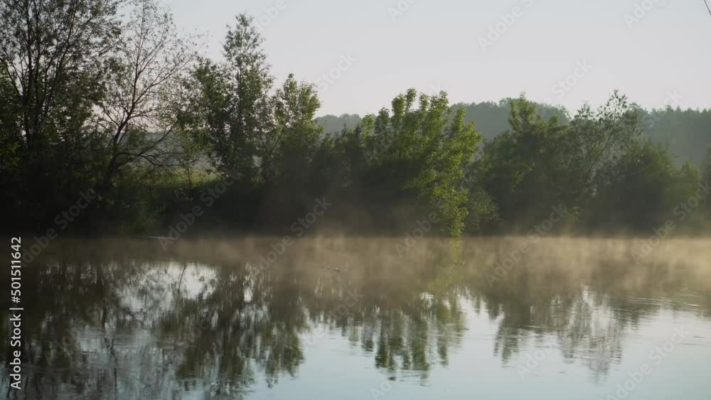 Sunrise on the river. Morning mist at dawn Sunrise on the river. Morning mist at dawn
