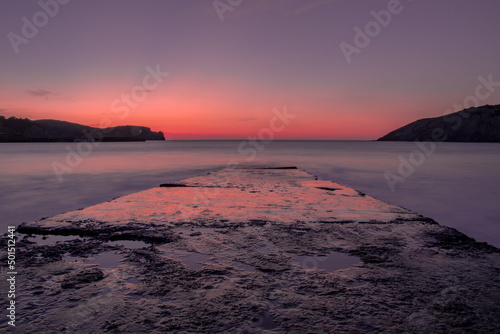 Long exposure shot of a magical sunset at Gorliz beach, Basque Country photo