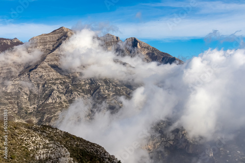 Panoramic view from Monte Comune on cloud covered peaks of Monte Molare, Canino, Caldare in Lattari Mountains, Apennines, Amalfi Coast, Italy, Europe. Hiking trail near the coastal town Positano. © Chris