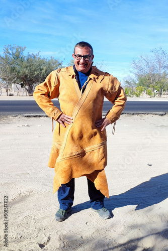 man wearing cow skin mexican poncho  baja california sur mexico photo