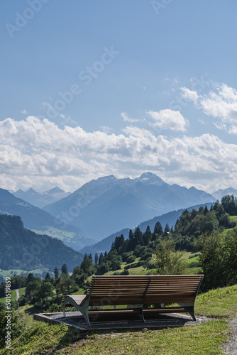 Wallpaper Mural Vertical photo of a bench and in nature with mountains in Falera, Surselva, Swit
