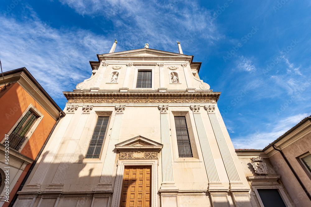 Brescia downtown. Facade of the ancient church of Santa Giulia (holy religious martyr) with the statues of San Biagio and San Benedetto, in Renaissance Style, 1593-1599. Lombardy, Italy, Europe.