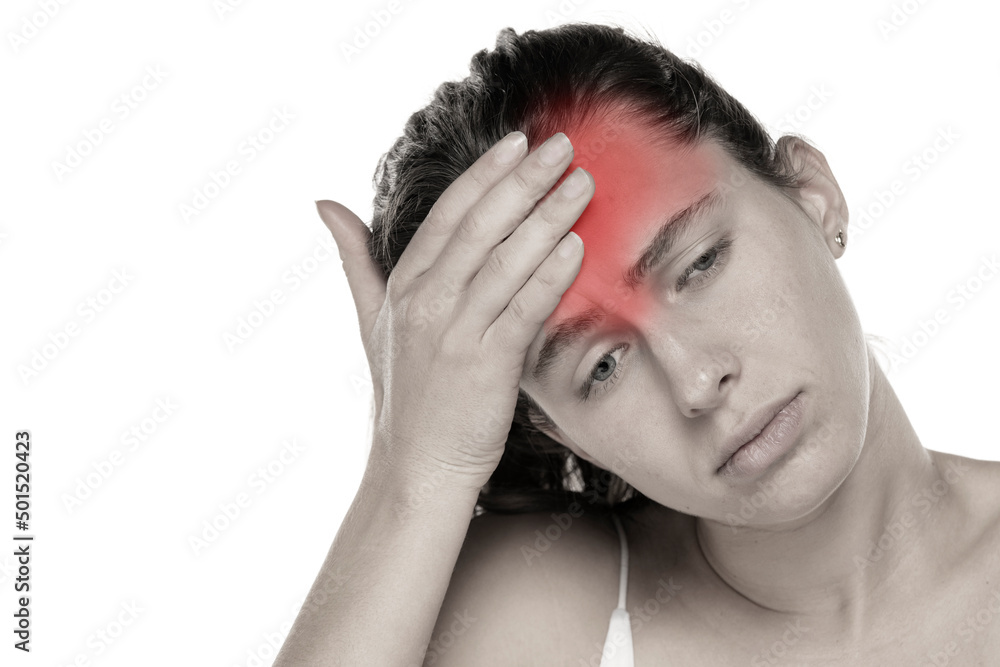Young woman with headache on a white background Young woman with headache on a white background