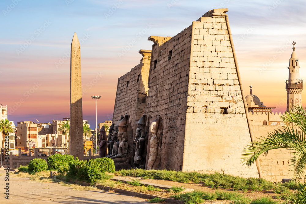 Pylon with obelisk in Luxor Temple, beautiful sunset view, Egypt