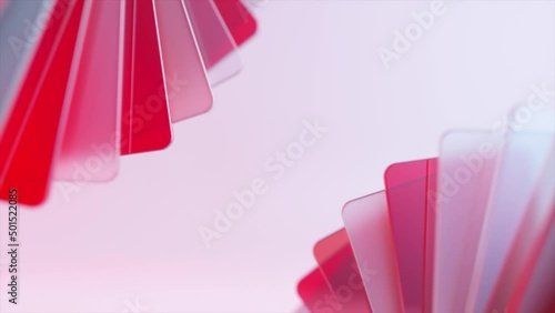 A fan of transparent, pink and red plastic cards unfolds. Plastic. Pink background. Inserts. 3d animation. photo