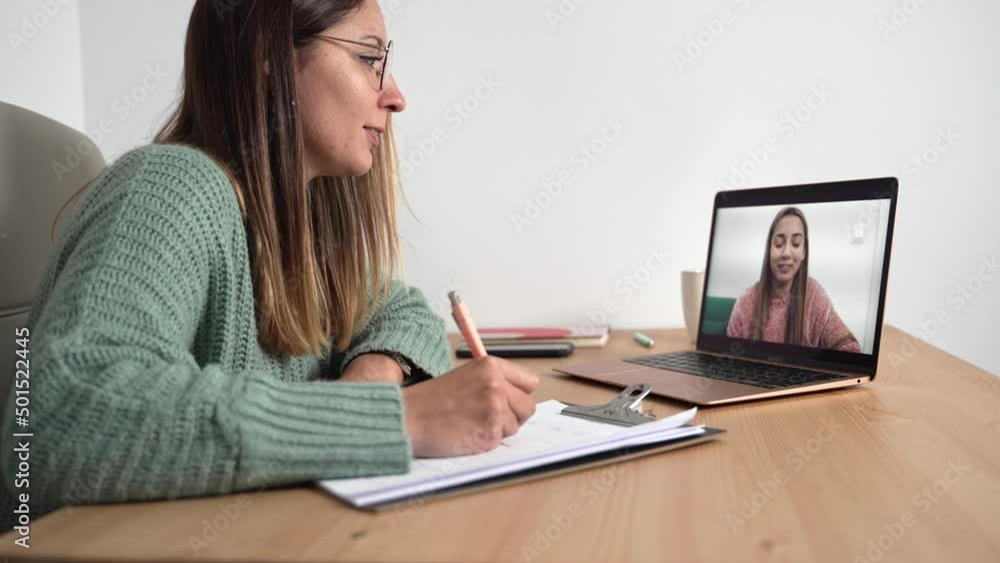Teenager Girl doing online therapy with psychologist for mental health support . Young woman therapist on video call with young patient Teenager Girl doing online therapy with psychologist for mental health support . Young woman therapist on video call with young patient