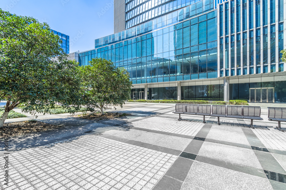 Fototapeta premium empty brick floor front of modern buildings.