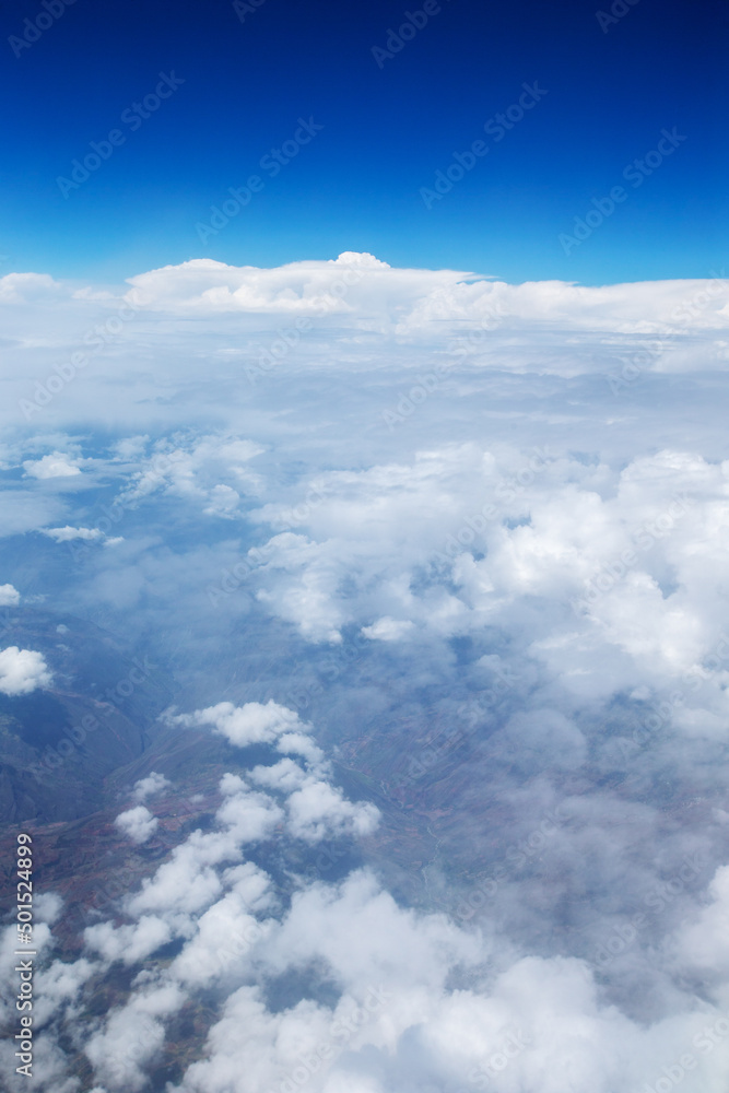 Fototapeta premium Clouds, a view from airplane window