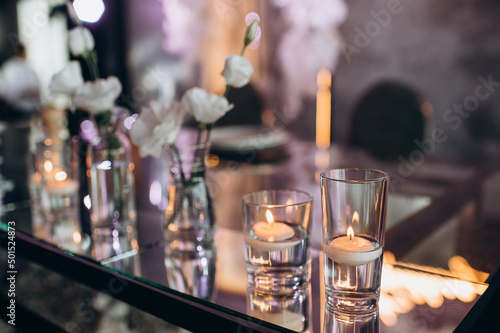 bohemian boho decor with candles on the wedding banquet table © Юлия Чернецкая