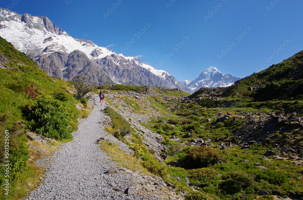 Walking the Hooker Valley Track, Mount Cook, New Zealand. Hiking and walking in the nature.