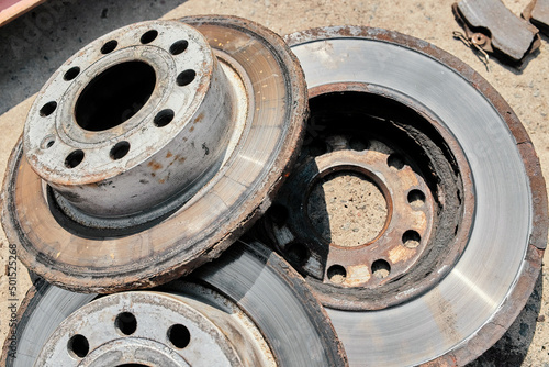 old used rusty car brake discs in bad condition