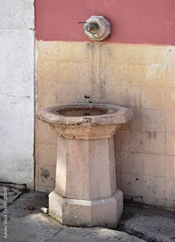 Old traditional public water fountain in Portugal 