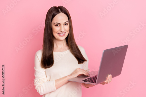 Photo of beautiful woman it specialist hold laptop home based business production wear nice pullover isolated pink color background