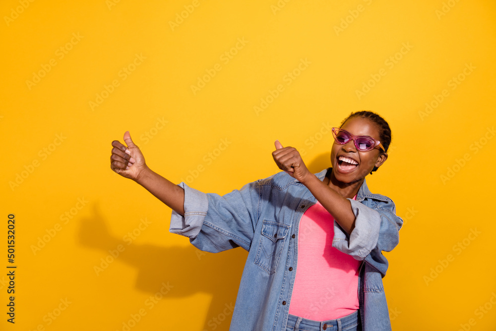 Naklejka premium Portrait of funky cheerful girl enjoy clubbing spend free time isolated on yellow color background