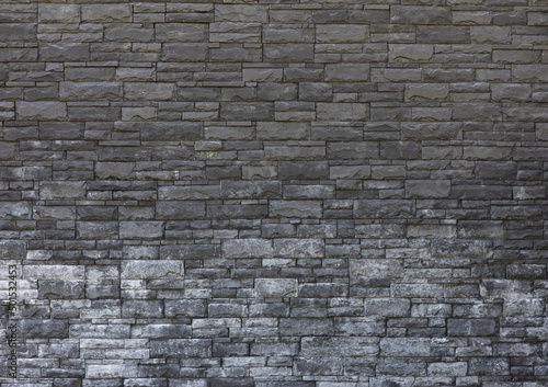 old masonry black stone wall
