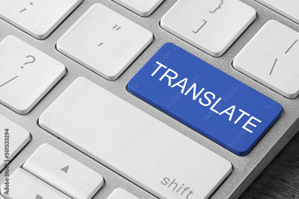 Blue button with word TRANSLATE on computer keyboard, closeup view Blue button with word TRANSLATE on computer keyboard, closeup view