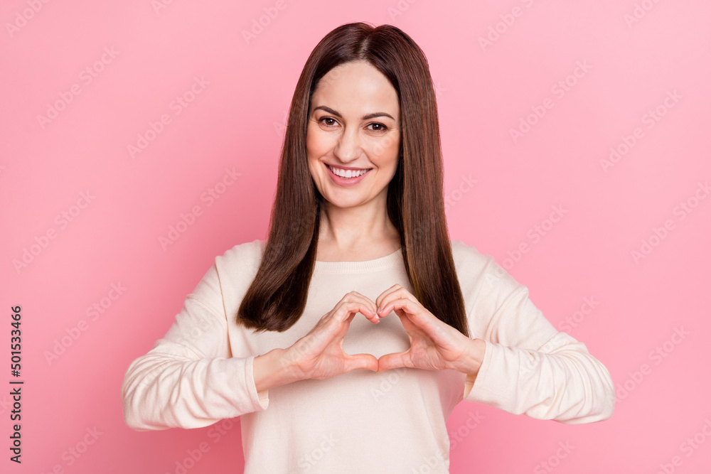 Photo of pretty lady hold hands heart shape love her children husband family wear long sleeve shirt isolated pink pastel color background Photo of pretty lady hold hands heart shape love her children husband family wear long sleeve shirt isolated pink pastel color background