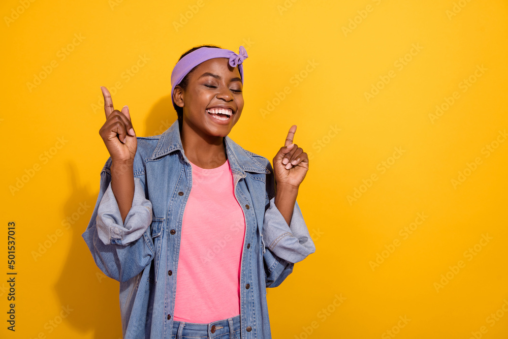 Photo of young excited lovely girl good mood free-time dream clubber isolated over yellow color background