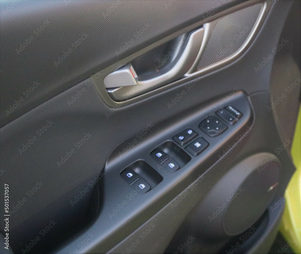 car door handle with adjustment knobs.