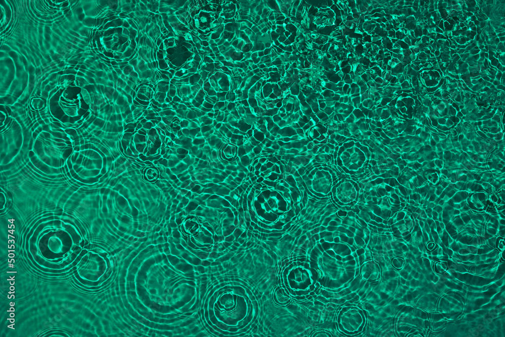 Transparent dark green clear water surface texture with ripples, splashes. Abstract nature background Water waves in sunlight with copy space, top view. Cosmetic moisturizer micellar toner emulsion Transparent dark green clear water surface texture with ripples, splashes. Abstract nature background Water waves in sunlight with copy space, top view. Cosmetic moisturizer micellar toner emulsion