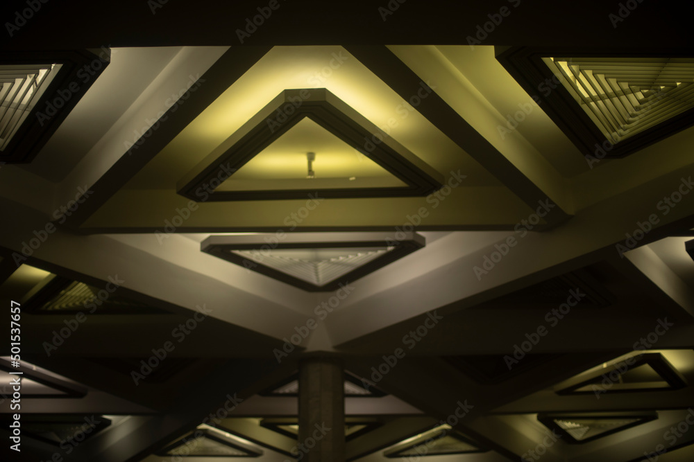 Light of lamps on ceiling. Architecture details. Triangles in building. Light of lamps on ceiling. Architecture details. Triangles in building.