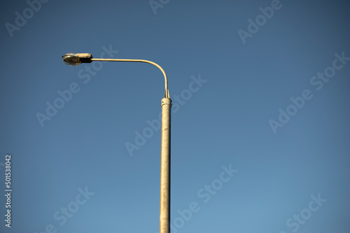 Street lamp. Lamp against sky. Urban infrastructure.