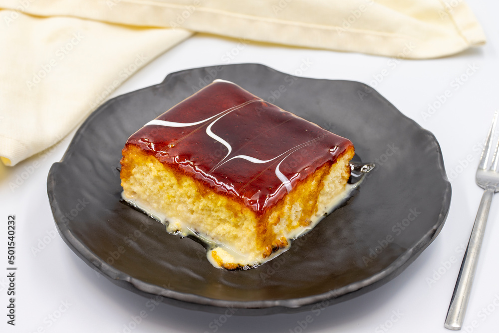 Trilece dessert with caramel on a white background. World cuisine desserts. close up Trilece dessert with caramel on a white background. World cuisine desserts. close up