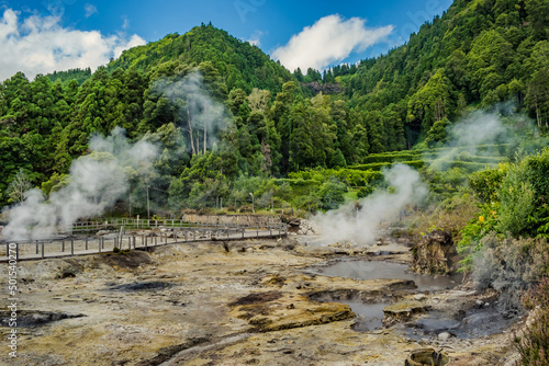 Hot and geothermal pools in activity with smoke with park and mountains with forest in the background in the famous Furnas, São Miguel - Azores PORTUGAL photo