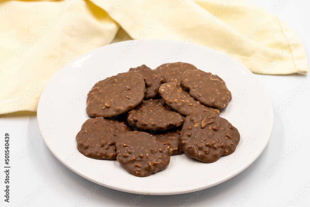 Chocolate with Hazelnut Chips. Special chocolates on a white background. close up Chocolate with Hazelnut Chips. Special chocolates on a white background. close up