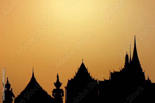 Silhouette wat phra kaew on gold background. © wasanajai
