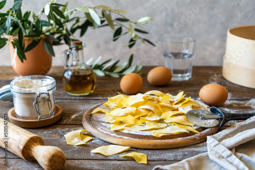 Homemade pasta Maltagliati with ingredients in rustic style photo