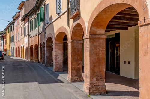 The colorful arcades of via Sanvitale  historic center of Fontanellato  Parma  Italy