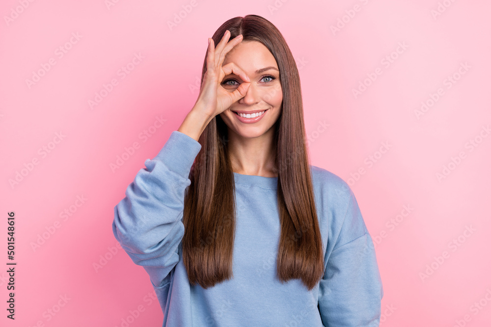 Portrait of attractive cheerful brunette girl showing ok-sign look see isolated over pink pastel color background Portrait of attractive cheerful brunette girl showing ok-sign look see isolated over pink pastel color background