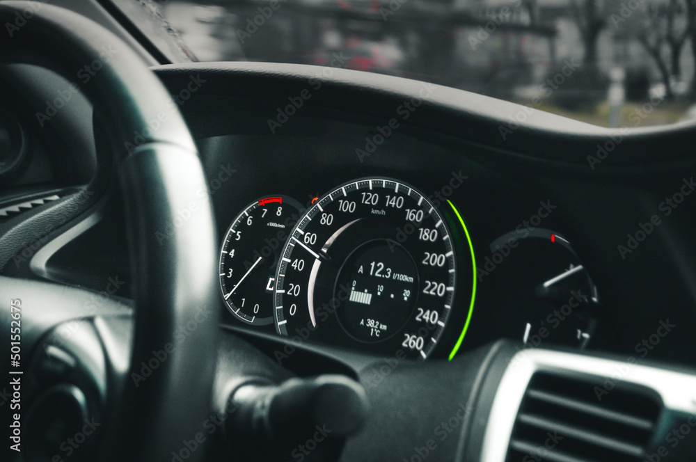 Modern car dashboard and tachometer with illumination. Closeup dashboard.