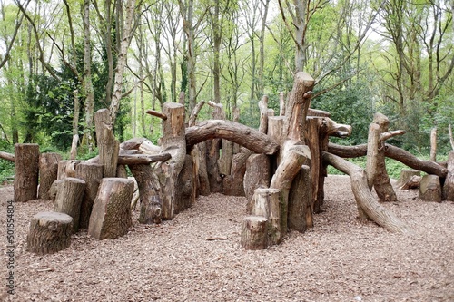 Natural woodland play area made with sustainably felled oak tree trunks on Chorleywood Common, Hertfordshire, England, UK